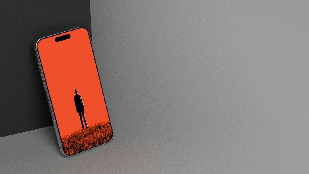 Smartphone mit rotem Bildschirm und schwarzer Silhouette auf grauem Hintergrund
